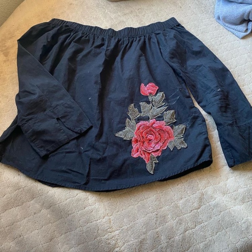 Black top with rose on the side